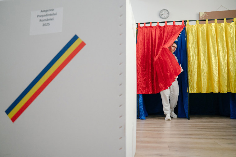 A voter holds her ballot