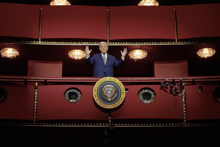 President Donald Trump looks down from the Presidential Box in the Opera House at the John F. Kennedy Center for the Performing Arts 