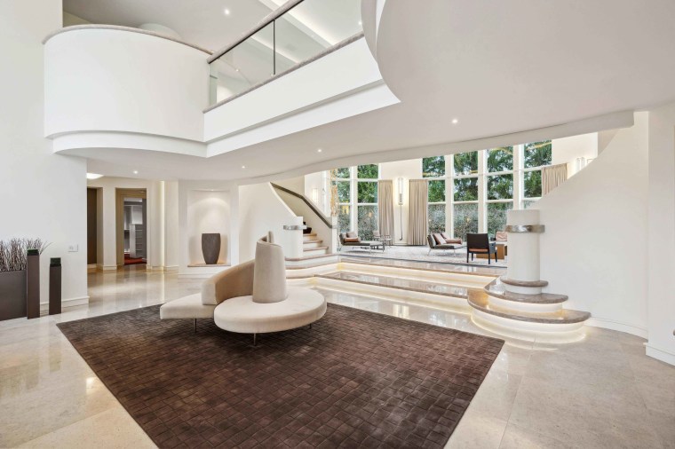 An entry living room space inside of a mansion