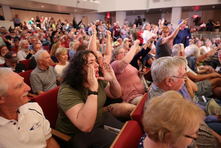 U.S. Representative Mike Flood (R-NE), answers questions from constituents during a town hall in Lincoln, Nebraska