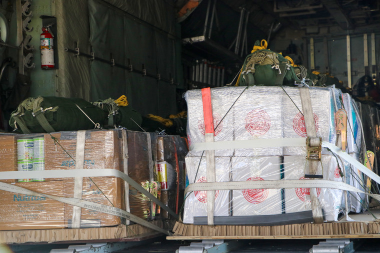 Boxes of aid, including baby formula, sit on a plane to be dropped over Gaza on Saturday.
